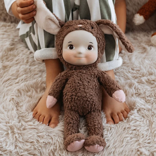 Maeve Rabbit brown cotton plush doll with silicone face held by a child - Lulliyo Lulliyo